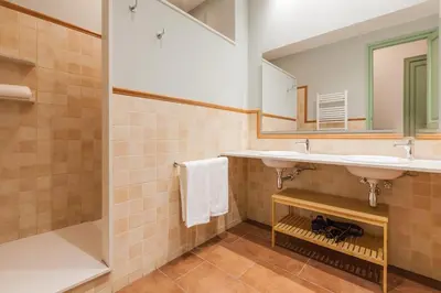 a bathroom with two sinks and a mirror at Modernist Apartment 2 in Barcelona