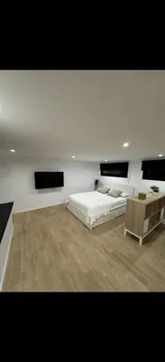 a living room with a couch in the middle at Apartamento colibrí in Sitges