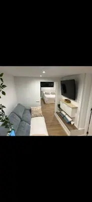 a kitchen with a sink and a washing machine at Apartamento colibrí in Sitges