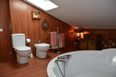 a bathroom with a toilet and a bath tub at Apart Villa Cristina 5 min walk to the beach RoofTop Duplex 180 M2 Very Cared in Sitges