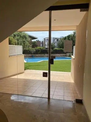 a glass door leading to a swimming pool at Apart Villa Cristina 5 min walk to the beach RoofTop Duplex 180 M2 Very Cared in Sitges