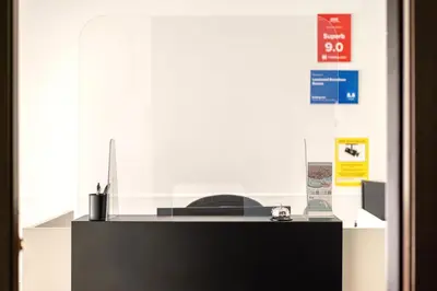 a desk with a computer on top of it at Laramond Barcelona Rooms in Barcelona