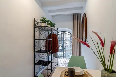 a room with a table and a chair and a window at 2537 - AB Sant Antoni Studio in Barcelona