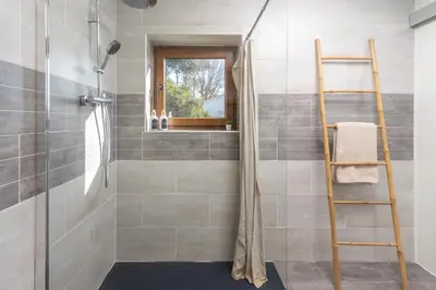 a shower with a ladder in a bathroom at Casa con encanto a los pies del Montseny in La Batlloria