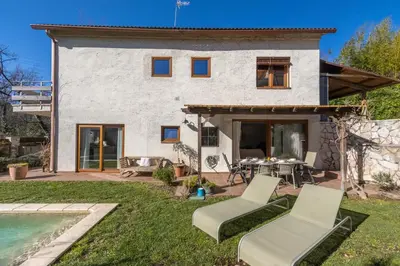 a villa with a swimming pool and a house at Casa con encanto a los pies del Montseny in La Batlloria