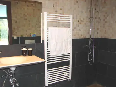a bathroom with a shower and a sink at Casa ceca de la Playa y Barcelona, con piscina climatizada y jacuzzi in Vallromanas