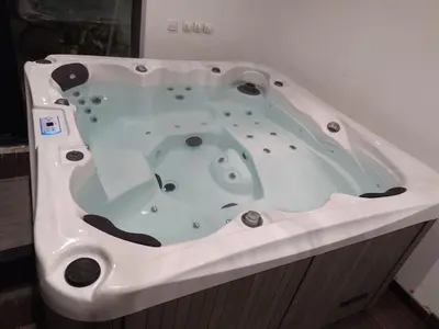 a jacuzzi tub in a bathroom at Casa ceca de la Playa y Barcelona, con piscina climatizada y jacuzzi in Vallromanas