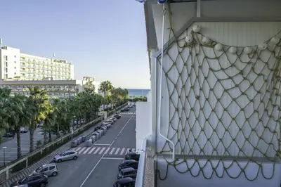a balcony with a view of a street with cars at HomeHolidaysRentals Pinedalovers - Costa Barcelona in Pineda de Mar