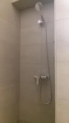 a shower with a shower head in a bathroom at Casa Abamita in Barcelona