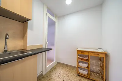 a kitchen with a sink and a counter top at HomeHolidaysRentals Magic - Costa Barcelona in Pineda de Mar