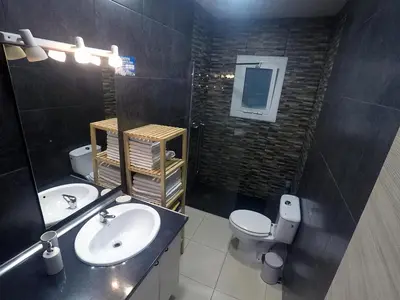a bathroom with a sink and a toilet at YOUR HOME - Sagrada Familia Apartment in Barcelona