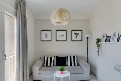 a living room with a couch and a table at 4 Bedroom High-Rise Apartment Amazing views! in Barcelona
