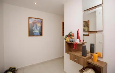 a living room with a santa hat on the wall at Beautiful Apartment In Pineda De Mar in Pineda de Mar