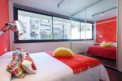 a bedroom with a bed and a large window at My Space Barcelona Private Pool Garden in Barcelona
