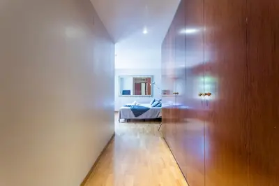a hallway with a door and a bed in a room at My Space Barcelona Bonanova Center in Barcelona