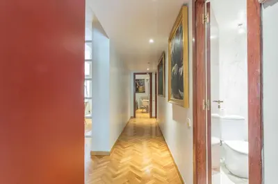 a hallway with a bathroom with a toilet and a sink at My Space Barcelona Bonanova Center in Barcelona