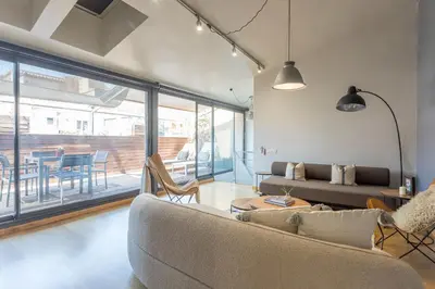 a living room with a couch and a table at My Space Barcelona Penthouse Terrace in Barcelona