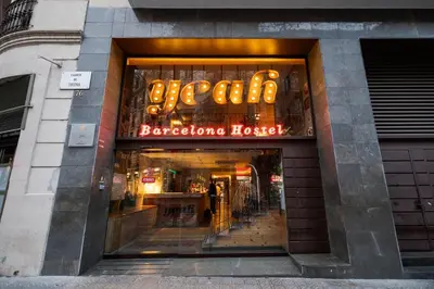 a store with a neon sign in the window at Yeah Barcelona Hostel in Barcelona