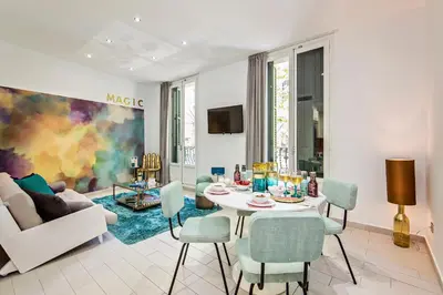 a white living room with a table and chairs at Sweett - Sants in Barcelona