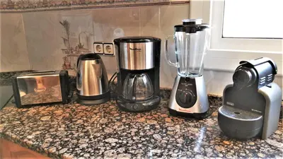 a group of appliances sitting on top of a counter at Villa Carolina in Mataró