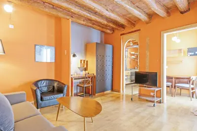 a living room with a couch and a table at Alcam Flassaders in Barcelona