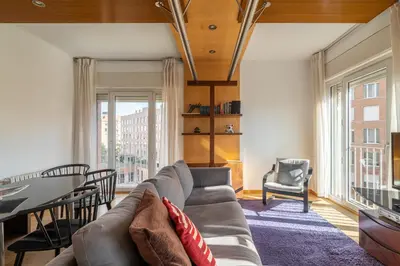 a living room with a couch and a table at Stay U-nique Apartments Salvador Espriu in Barcelona