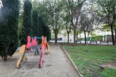 a row of playground equipment in a park at Alcam Olimpic in Barcelona