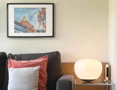 a living room with a couch and a table with a lamp at Stay U-nique Apartments Venecuela in Barcelona