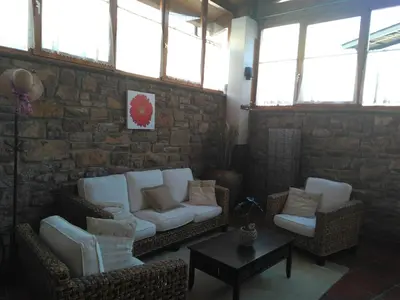a living room with a couch and two chairs at Hotel Can Missé in Collbató
