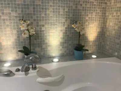 a white bath tub with flowers on top of it at Enric Granados 17 in Barcelona