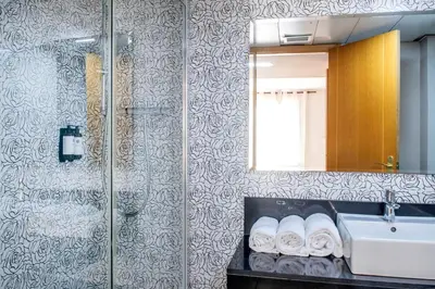 a bathroom with a sink and a mirror at Aparthotel Rambla108 in Barcelona