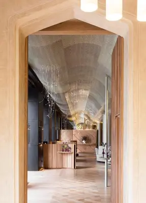 a hallway with a vaulted ceiling with chandeliers at Monument Hotel in Barcelona