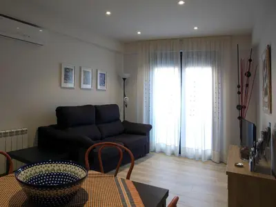 a living room with a couch and a table at Cal Negri in Vilafranca del Penedès