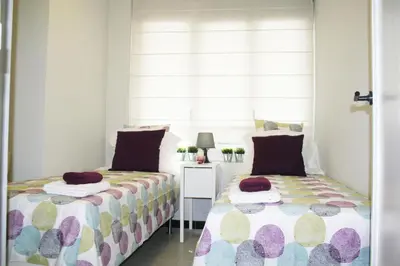 a bathroom with a mirror and a sink in a room at Apartment Carrer Lepant in Barcelona