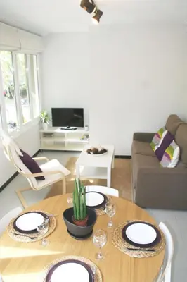 a bedroom with two beds and a window at Apartment Carrer Lepant in Barcelona