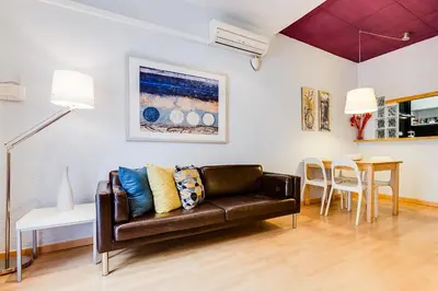 a living room with a couch and a table at Deep Purple in Barcelona