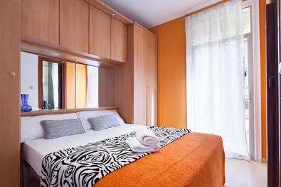 a bedroom with a bed with a zebra print blanket at Deep Purple in Barcelona