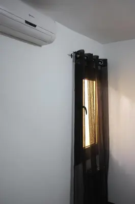a window in a room with a black curtain at Hostal Europa in Barcelona