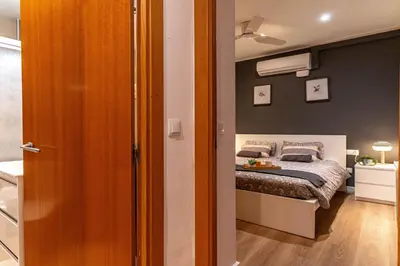 a small bedroom with a bed in a room at Lindo apartamento Vila de Gracia in Barcelona