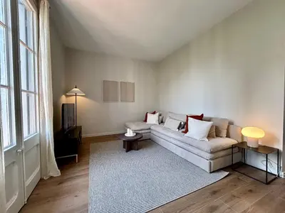 a living room with a couch and a rug at BarcelonaForRent Plaza Sagrada Familia in Barcelona