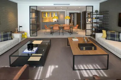 a living room with two couches and a table at Midtown Apartments in Barcelona