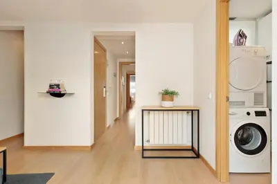 a laundry room with a washer and dryer in it at Sitges Group Soul in Sitges
