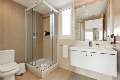 a bathroom with a shower and a toilet and a sink at Sitges Group Soul in Sitges