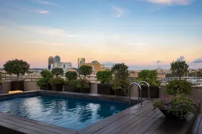 a swimming pool on the roof of a building at Duquesa Suites Landmark Hotel by Grup Duquessa in Barcelona