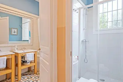 a bathroom with a shower and a sink at Villa Modernista in Barcelona