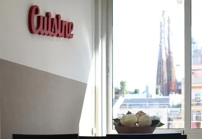 a window with a bowl of plants in front of it at Suite Place Barcelona Còrsega in Barcelona