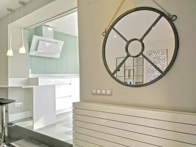 a bathroom with a large clock on the wall at Ferran Pedralbes Penthouse in Barcelona