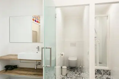 a white bathroom with a sink and a toilet at Apartment in downtown Barcelona - Vintage in Barcelona