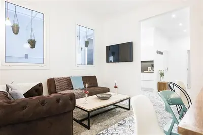 a living room with a couch and a table at Apartment in downtown Barcelona - Vintage in Barcelona