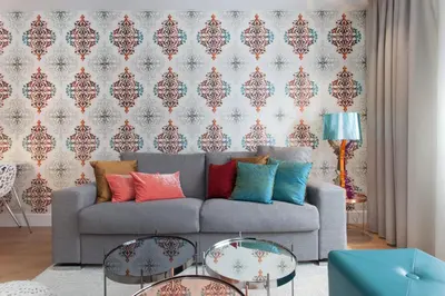 a living room with a couch with colorful pillows at Passeig de Gracia Apartment in Barcelona